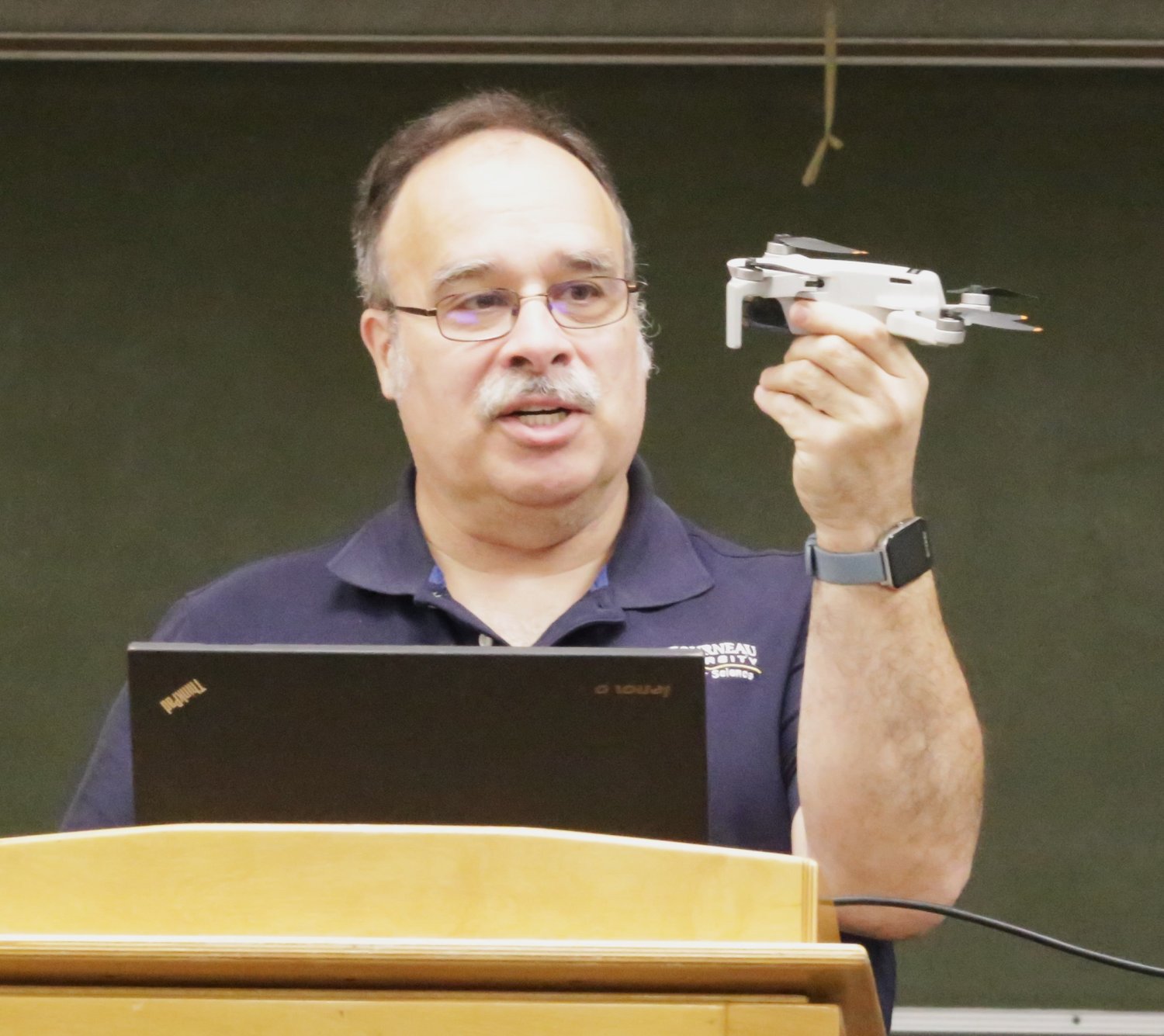 Dr. Glyn Gowing of LeTourneau University makes a point about miniaturization at his briefing to the Experimental Aircraft Association (EEA) last Saturday.