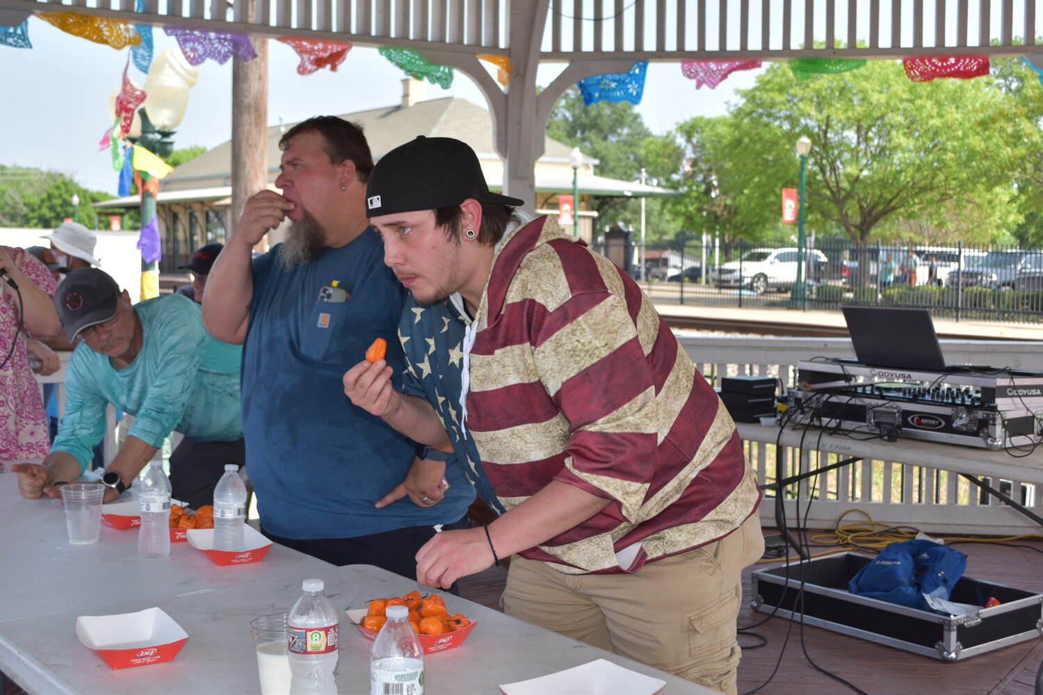 Keith Fisher, left, outdueled Ricki Phelps to win the pepper-eating contest. (Monitor photo by Phil Major)