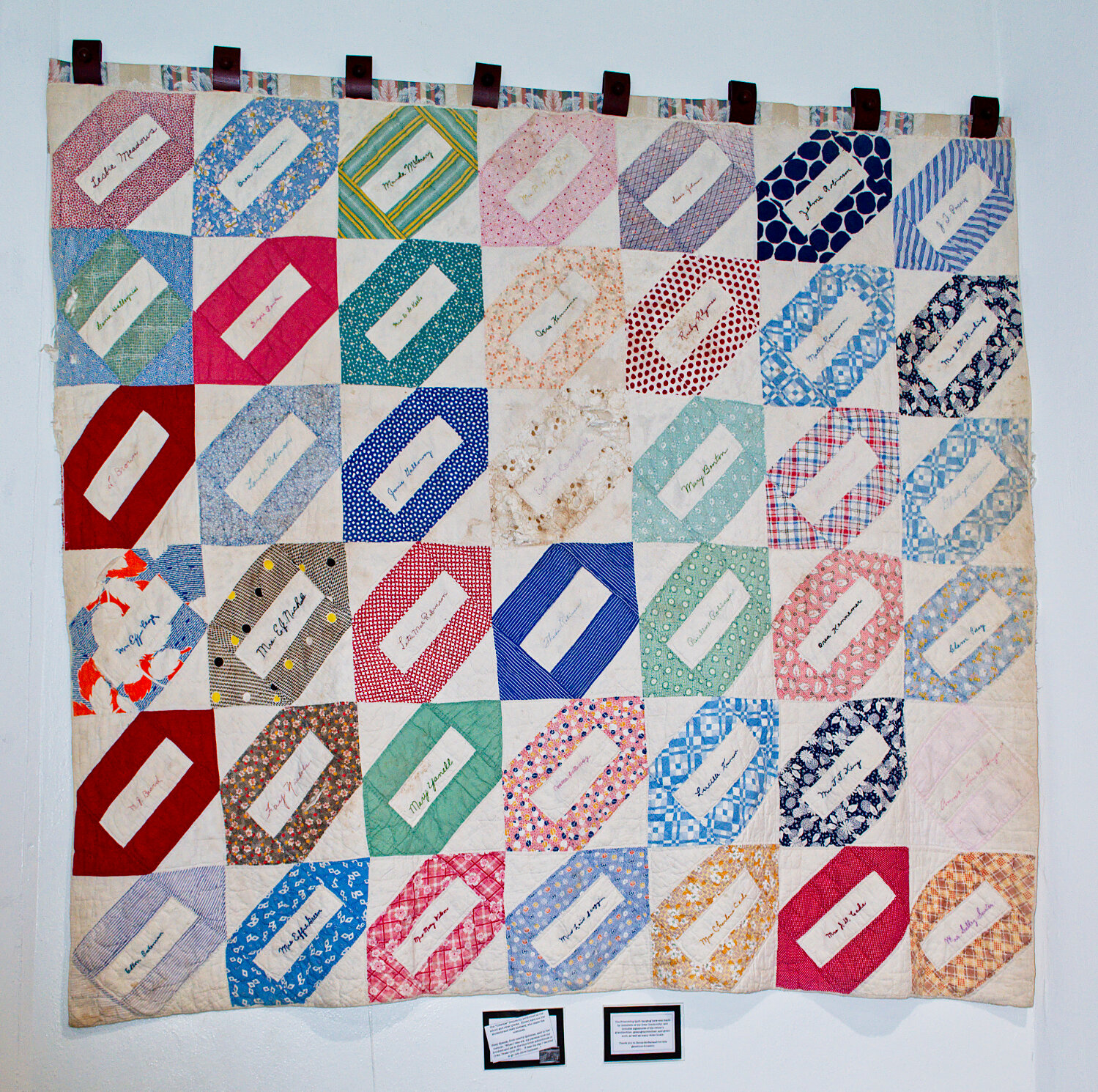A friendship quilt from the Coke community contains many familiar family names. It has a place of honor in the old school auditorium.