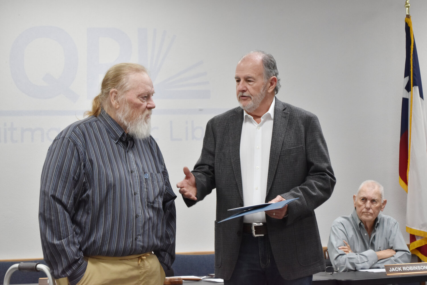 Quitman Mayor Randy Dunn (right) speaks about Larry Tucker during Thursday’s Quitman City Council meeting, where Tucker was honored for his years of community service.