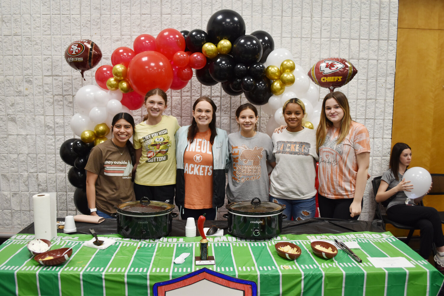 The Mineola Middle School Builders Club won the booth decorting contest at the annual Mineola Kiwanis Club chili cookoff Saturday. The service club is sponsored by Kiwanis. Manning the booth were, from left, Ashley Ventura, Shayleigh Threlkeld, Mrs. Cameron Stack, Emberly Weatherford, Kristasia Rossie and Ava Halbert. The People’s Choice award went to Bobby Tucker for Constable for raising the most tips.